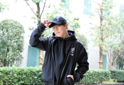 Takanori Nishikawa, the Japanese singer known as T.M.Revolution, in a black cap and hooded jacket during a 2022 interview