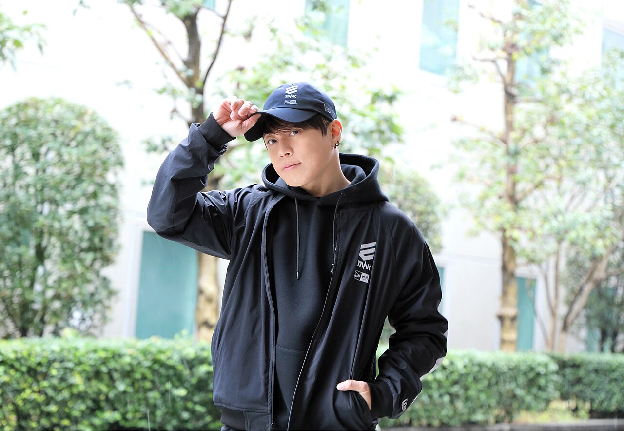 Takanori Nishikawa, the Japanese singer known as T.M.Revolution, in a black cap and hooded jacket during a 2022 interview