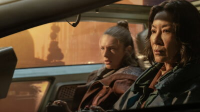 Hunter Schafer as Cora and Michelle Yeoh as Olwen in a spinner in Prime Video’s Blade Runner 2099