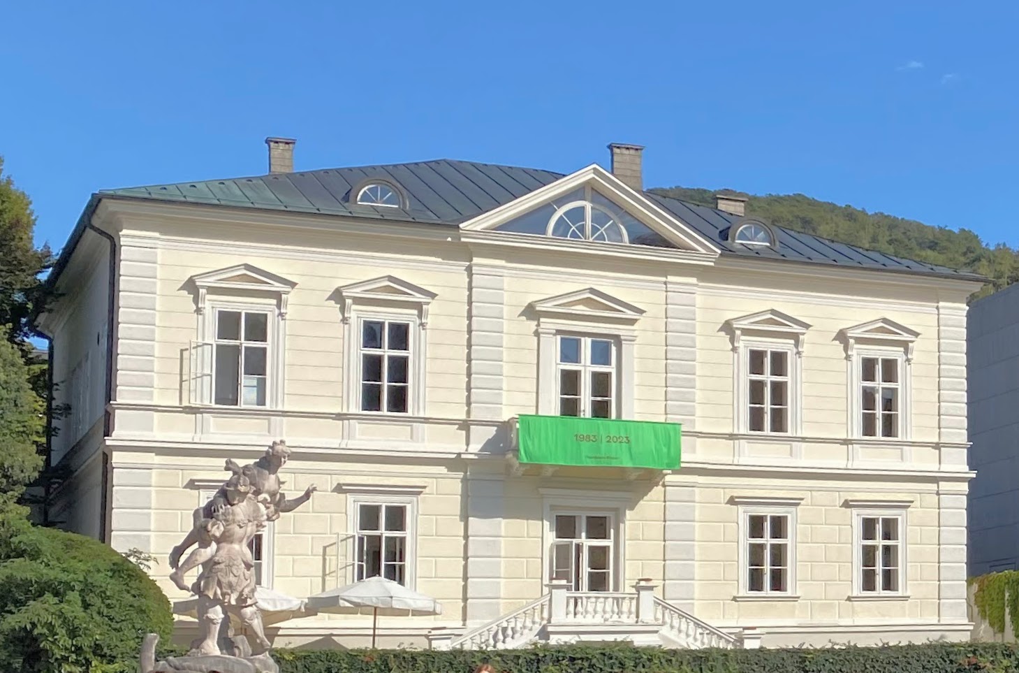 Villa Kast in Salzburg, the flagship of Galerie Thaddaeus Ropac, with a green 1983 2023 anniversary banner on its facade