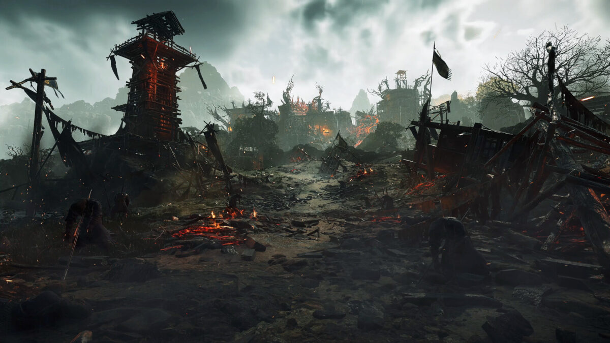 Wo Long 2: Wings of Ember screenshot: a smouldering open battlefield with a ruined watchtower