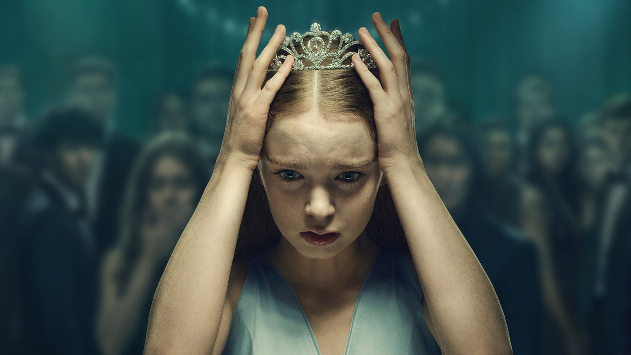 Summer H. Howell as Carrie White pressing a silver prom tiara onto her head in key art for Prime Video's Carrie