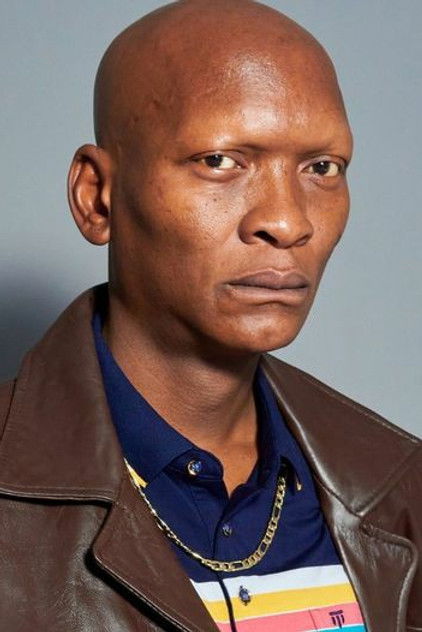 Warren Masemola als Minister Vilakazi