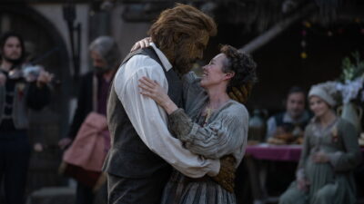 Olivia Colman embraces Alexander Skarsgård as the Wicker Husband at a village celebration in Wicker, directed by Alex Huston Fischer and Eleanor Wilson