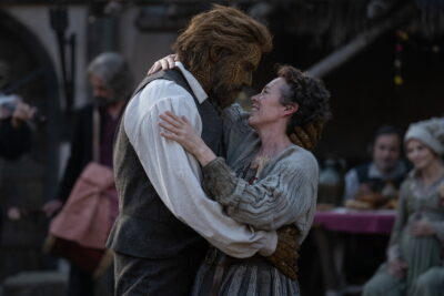 Olivia Colman embraces Alexander Skarsgård as the Wicker Husband at a village celebration in Wicker, directed by Alex Huston Fischer and Eleanor Wilson