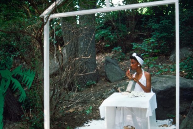 Lorraine O'Grady, Rivers, First Draft: The Woman in White eats coconut and looks away from the action, 1982/2015, digital C-print from Kodachrome 35mm slides in 48 parts, 16 x 20 in (40.64 x 50.8 cm), edition of 8 plus 2 AP