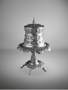 A silver betel box with scenes of the Sama Jataka   Lower Burma (Myanmar), dated 1909   Estimate: US$40,000-60,000 