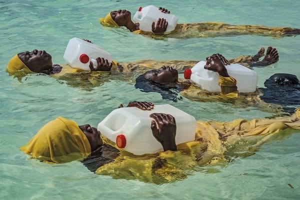 Anna Boyiazis, Kijini Primary School students learn to float, swim and perform rescues in the Indian Ocean off of Muyuni, Zanzibar, 2016. Archival pigment print, 30 x 40 inches. ©Anna Boyiazis, Courtesy Monroe Gallery of Photography, Santa Fe