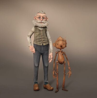 Mackinnon & Saunders. Geppetto and Pinocchio Production Puppets, 2019-2020. Geppetto: steel, foam latex, silicone, resin, fabric, fiber, plastic. 4 x 4 ¾ x 14″ (10.2 x 12.1 x 35.6 cm). Pinocchio: 3D printed resin, 3D printed steel, steel, silicone, paint. 4 x 3 x 9.5″ (10.2 x  7.6 x 24.1 cm). Guillermo del Toro’s Pinocchio, 2022. Image courtesy Netflix