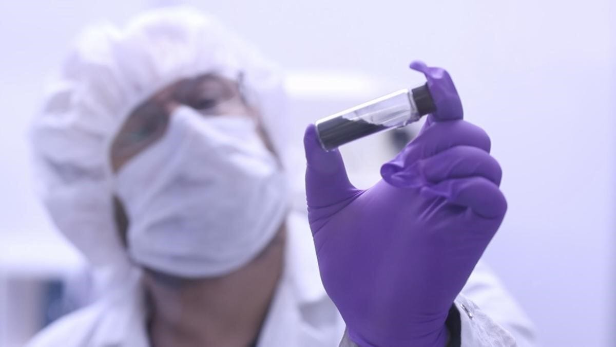 In this video frame, Jason Dworkin holds up a vial that contains part of the sample from asteroid Bennu delivered to Earth by NASA's OSIRIS-REx (Origins, Spectral Interpretation, Resource Identification, and Security – Regolith Explorer) mission in 2023. Dworkin is the mission's project scientist at NASA's Goddard Space Flight Center in Greenbelt, Maryland. Credit: NASA/James Tralie