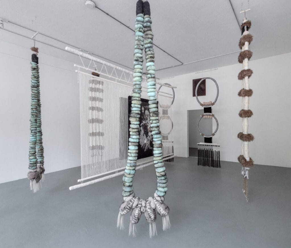 Installation view, Eric-Paul Riege, (my god, YE’ii [1-2]) (jaatłoh4Ye’iitsoh [1–6]) (a loom between
Me+U, dah ‘iistł’ǫ́), Bockley Gallery, 2021. Photo by Rik Sferra. Image courtesy of the artist and
Bockley Gallery  